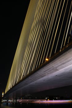 Steel line of Rama 8 Bridge at night.