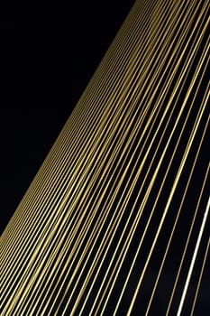 Steel line of Rama 8 Bridge at night.