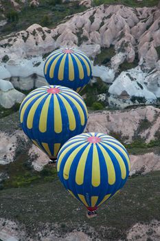 Pair of hot air balloons cruising in air