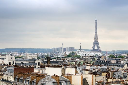 Eiffel Tower and Grand Palais with roofs of Paris, France