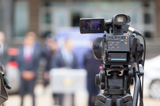 Press conference. Covering an event with a video camera.