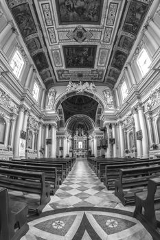 interior of an old Italian church with white columns and ornate ceiling