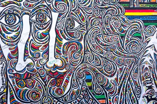 Berlin, Germany - October 26, 2013: East Side Gallery - an international memorial for freedom. Former Berlin Wall - a barrier within Germany, dividing the country.