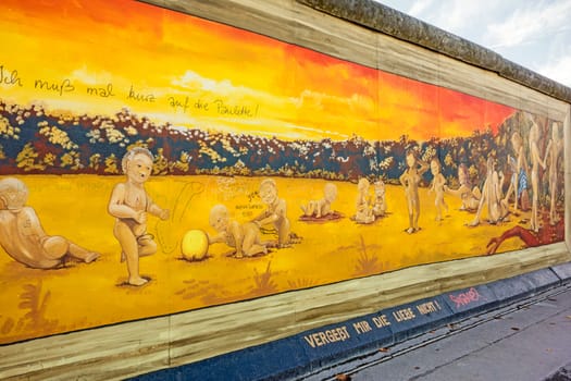 Berlin, Germany - October 26, 2013: East Side Gallery - an international memorial for freedom. Former Berlin Wall - a barrier within Germany, dividing the country.