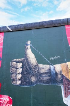 Berlin, Germany - October 26, 2013: East Side Gallery - an international memorial for freedom. Former Berlin Wall - a barrier within Germany, dividing the country.