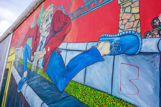 Berlin, Germany - October 26, 2013: East Side Gallery - an international memorial for freedom. Former Berlin Wall - a barrier within Germany, dividing the country.