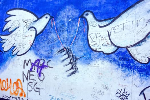 Berlin, Germany - October 26, 2013: East Side Gallery - an international memorial for freedom. Former Berlin Wall - a barrier within Germany, dividing the country.