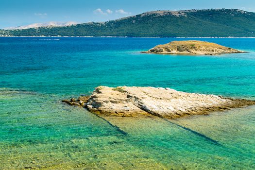 The crystal clear sea surrounding the island of Rab, Croatian tourist resort.