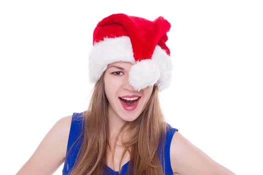 Portrait of joyful pretty woman in red santa claus hat laughing isolated on white background. Beautiful girl looking happy and excited. Happy Christmas and New Year holidays full of fun.