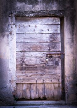 old wooden door of an empty house