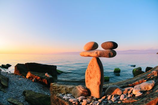 Balancing of stones each other on the seashore