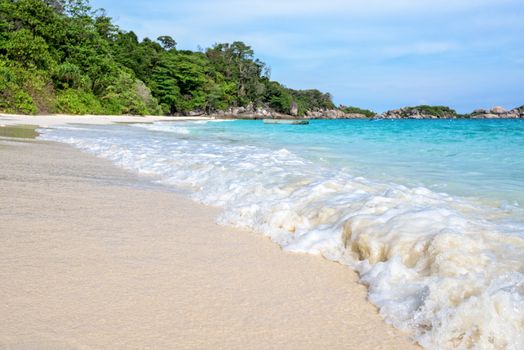Beautiful nature of blue sea sand and white waves on the beach during summer at Koh Miang island in Mu Ko Similan National Park, Phang Nga province, Thailand