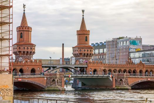 Berlin, Germany - October 26, 2013: Bridge Oberbaumbruecke - an international memorial for freedom. Former Berlin Wall - a barrier within Germany, dividing the country.