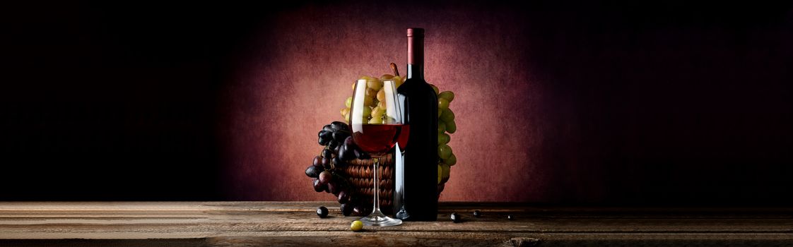 Wine with grape in basket on a vinous background
