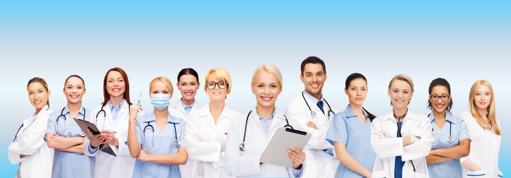 healthcare, technology and medicine concept - smiling female doctors and nurses with tablet pc computer