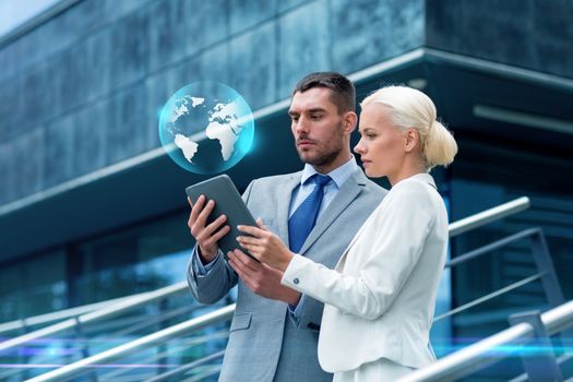 business, partnership, technology and people concept - businessman and businesswoman working with tablet pc computer and globe hologram on city street