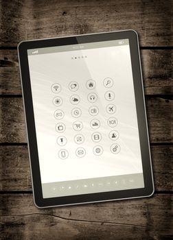 Digital tablet PC with desktop icons on a dark wood table - vertical office mockup