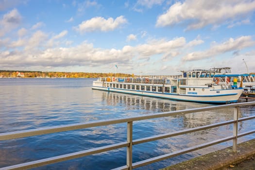 Berlin, Germany - October 27, 2013: View over the Lake Wannsee - the biggest in the hinterland of Berlin. Shipping pier with passenger ship on the right.