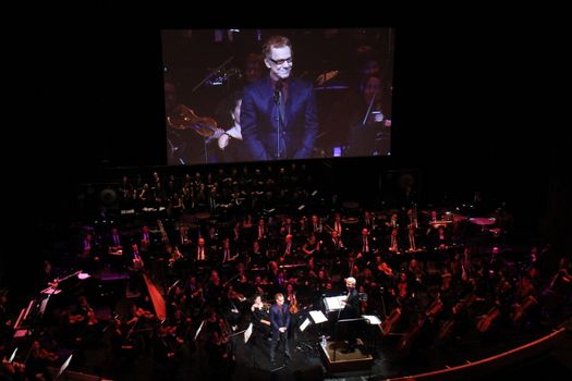 FRANCE, Paris: American composer Danny Elfman and the Lamoureux orchestra perform on the stage of the Grand Rex, in Paris, during the show Danny Elfman's music from the films of Tim Burton, on October 10, 2015.