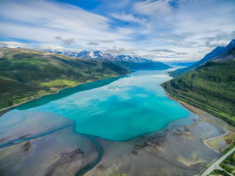Aerial view of turquoise waters of Lyngen fjord in Norway