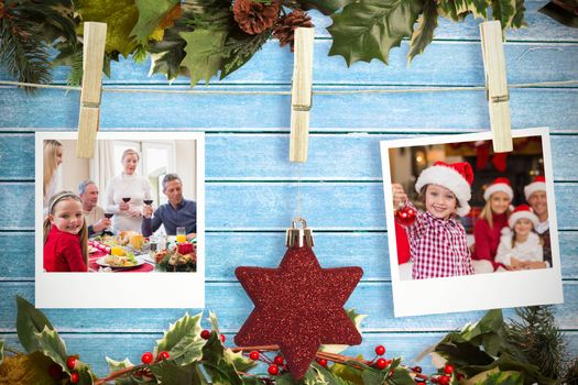 Hanging christmas photos against wooden planks