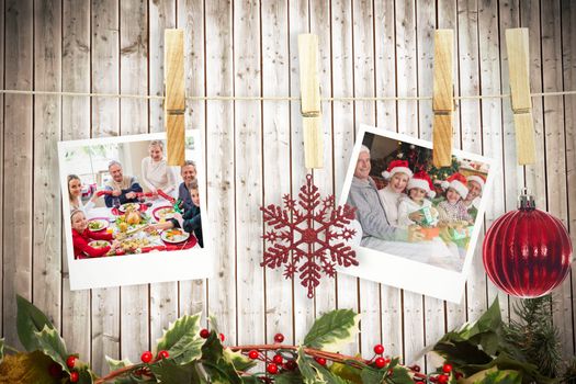 Hanging christmas photos against wooden planks background
