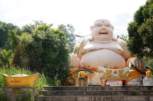 Hat Yai, Thailand -  13 Sept, 15 : Fat Laughing Buddha was blessing people for happiness, health, wealth. Goddess of  Compassion &amp; Mercy is located on top of a hill at Hat Yai Municipal Park. It is about 1000 steps to the hilltop where there is 360 degree panoramic view of Hat Yai City and Songkhla.