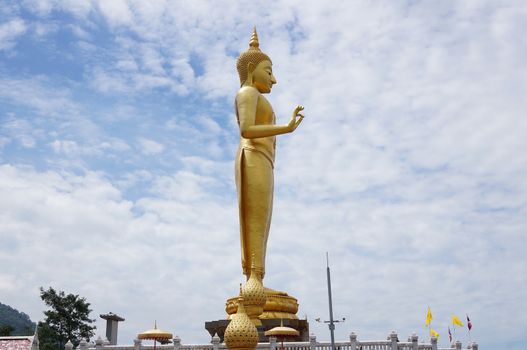 Hat Yai, Thailand -  13 Sept, 15 :  It is around 20 meters weighs 200 tons and was made in 1999 to celebrate the King of Thailand's 6th Cycle Birthday Celebration which was his 72nd birthday. With His right had raised with forefinger and thumb touching each other, this mudra denotes 'Intelligence, Intellect and Integrity'. Hat Yai Observatory is Hat Yai's deep sky observation for science and astronomy. Located in the vicinity of this temple.