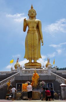 Hat Yai, Thailand -  13 Sept, 15 :  It is around 20 meters weighs 200 tons and was made in 1999 to celebrate the King of Thailand's 6th Cycle Birthday Celebration which was his 72nd birthday. With His right had raised with forefinger and thumb touching each other, this mudra denotes 'Intelligence, Intellect and Integrity'. Hat Yai Observatory is Hat Yai's deep sky observation for science and astronomy. Located in the vicinity of this temple.