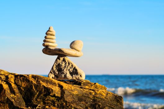 Balancing of stones each other on the seashore