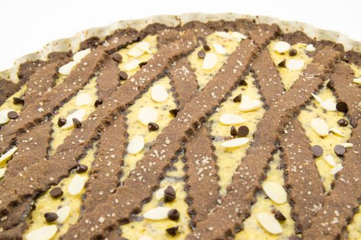 freshly baked cocoa tart with ricotta cheese and chocolate