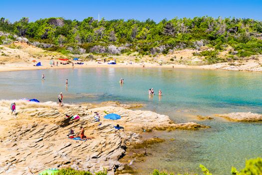 RAB, CROATIA - CIRCA AUGUST 2015: The pristine coastline and crystal clear water of the island of Rab, Croatia.