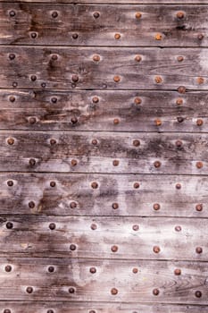 Texture formed by a wooden portal of an italian palace.