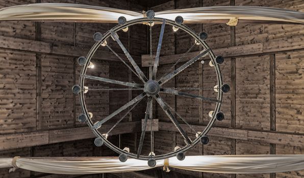 Round iron chandelier in an old tavern.