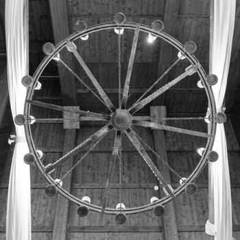 Round iron chandelier in an old tavern.