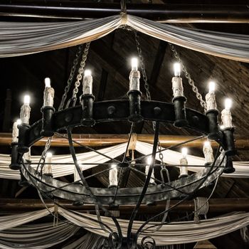 Round iron chandelier in an old tavern.