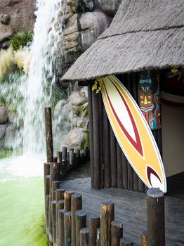 HONOLULU, HAWAII - MAY 9: Colorful surfboards in front of a typical Hawaiian hut.