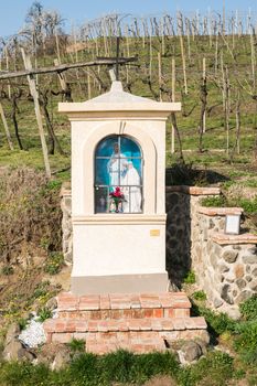 Italian traditional votive temple in the countryside dedicated to the Virgin Mary to propitiate the harvest