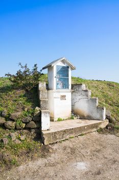 Italian traditional votive temple in the countryside dedicated to the holy family to propitiate the harvest