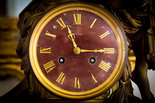 detail of antique table clock with manual winding