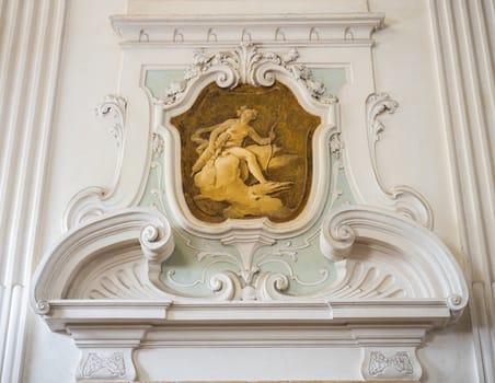 the ornament of a fireplace hood in a Venetian neo classical villa