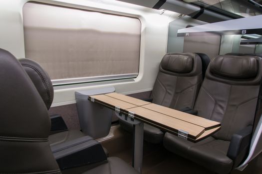 business class with leather seats of a railroad car