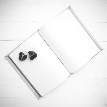 heart on notebook over white table black and white tone color style