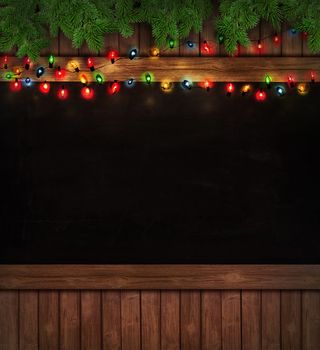 Christmas holiday lights on wooden blackboard