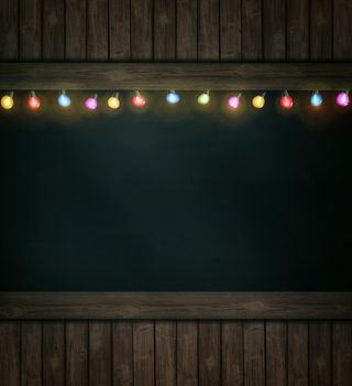 Christmas holiday lights on wooden blackboard