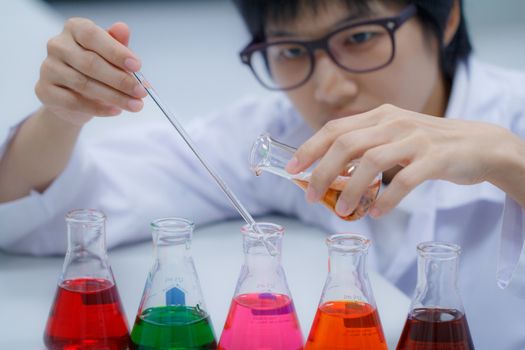 Researcher working with chemical