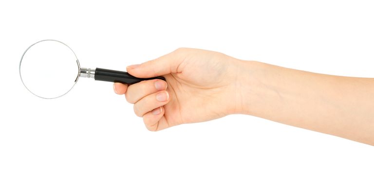 Humans hand holding magnifier on isolated white background