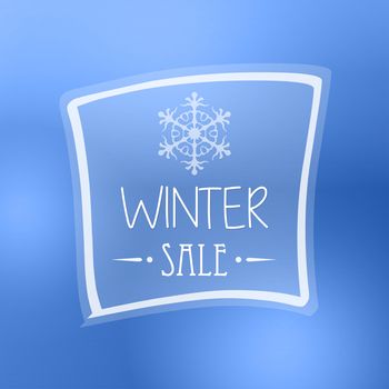 text winter sale with snowflake in frame over blue background