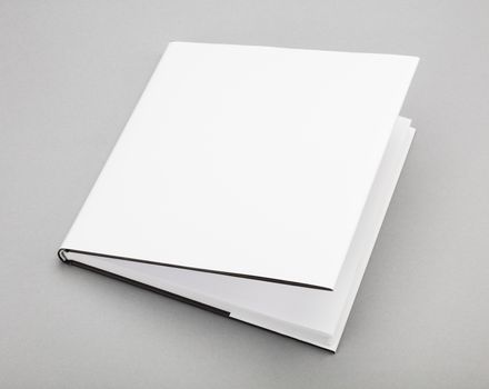 Blank book with ajar white cover