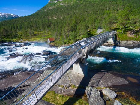 Bridge across Likholefossen waterfalls in Norway, popular tourist attraction